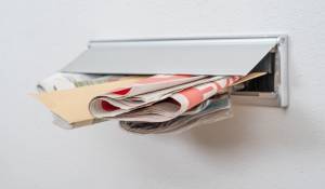 direct mail in a mail slot for article about printing advertising